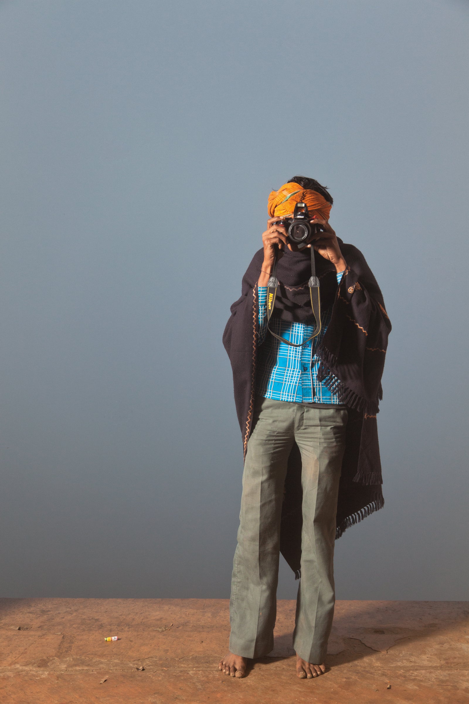 A pilgrim taking a photo at Keshi Ghat
