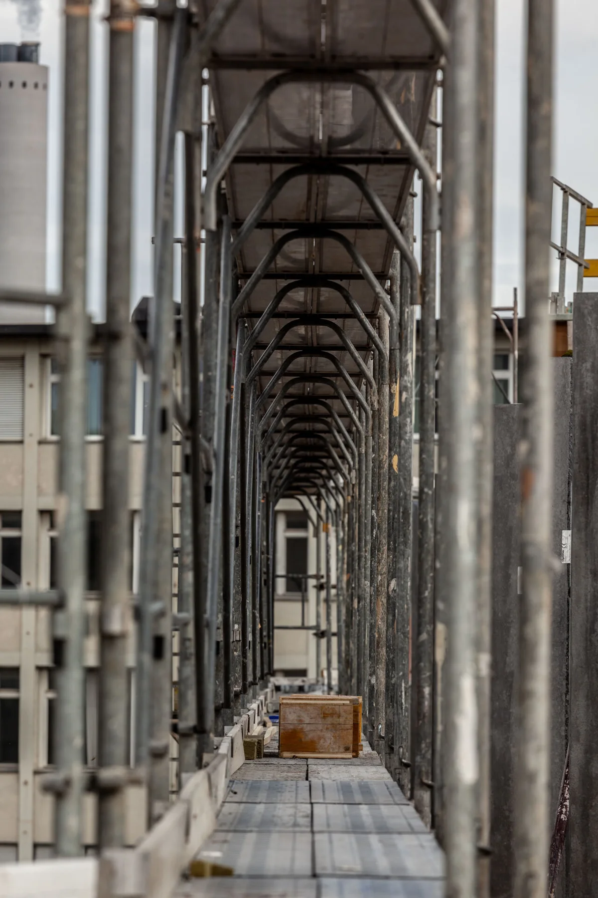 Architectural photograph of a long passage with repeating columns