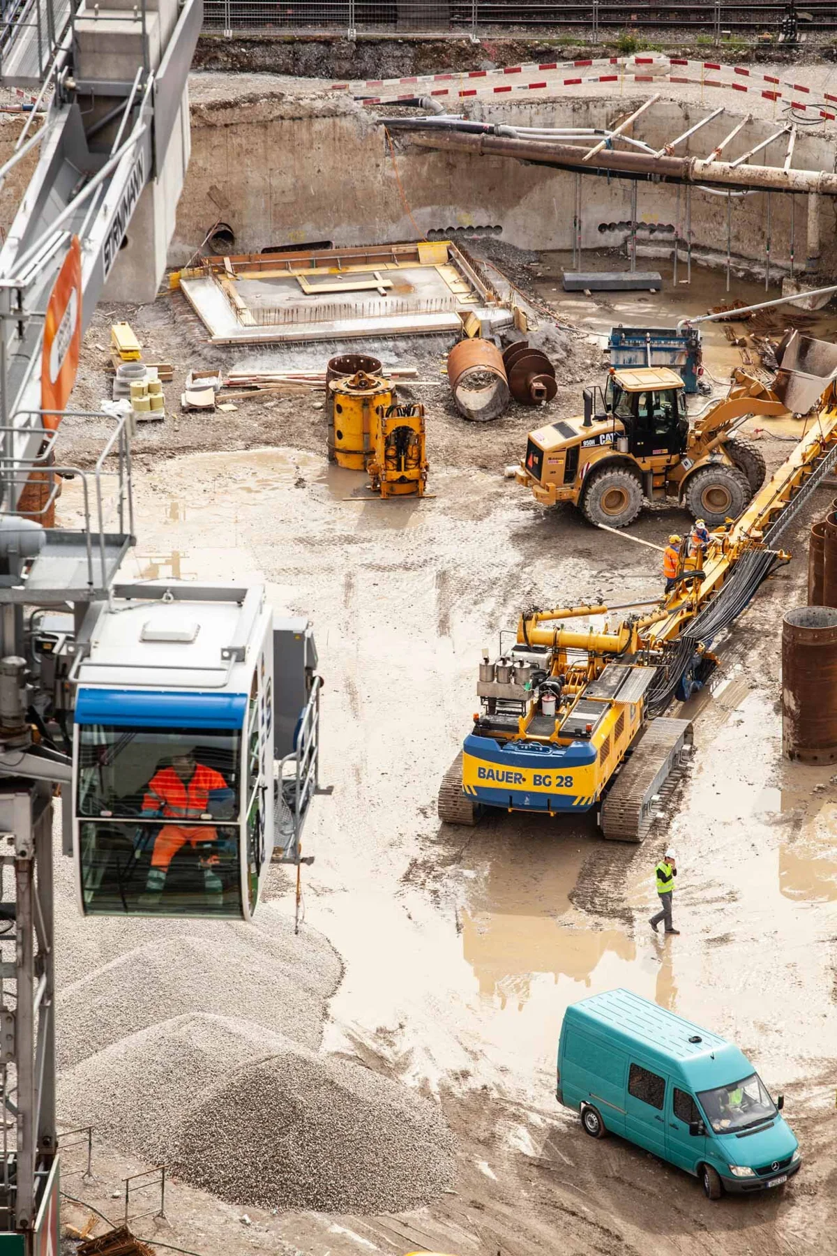 Overhead view of a building site with machinery and workers