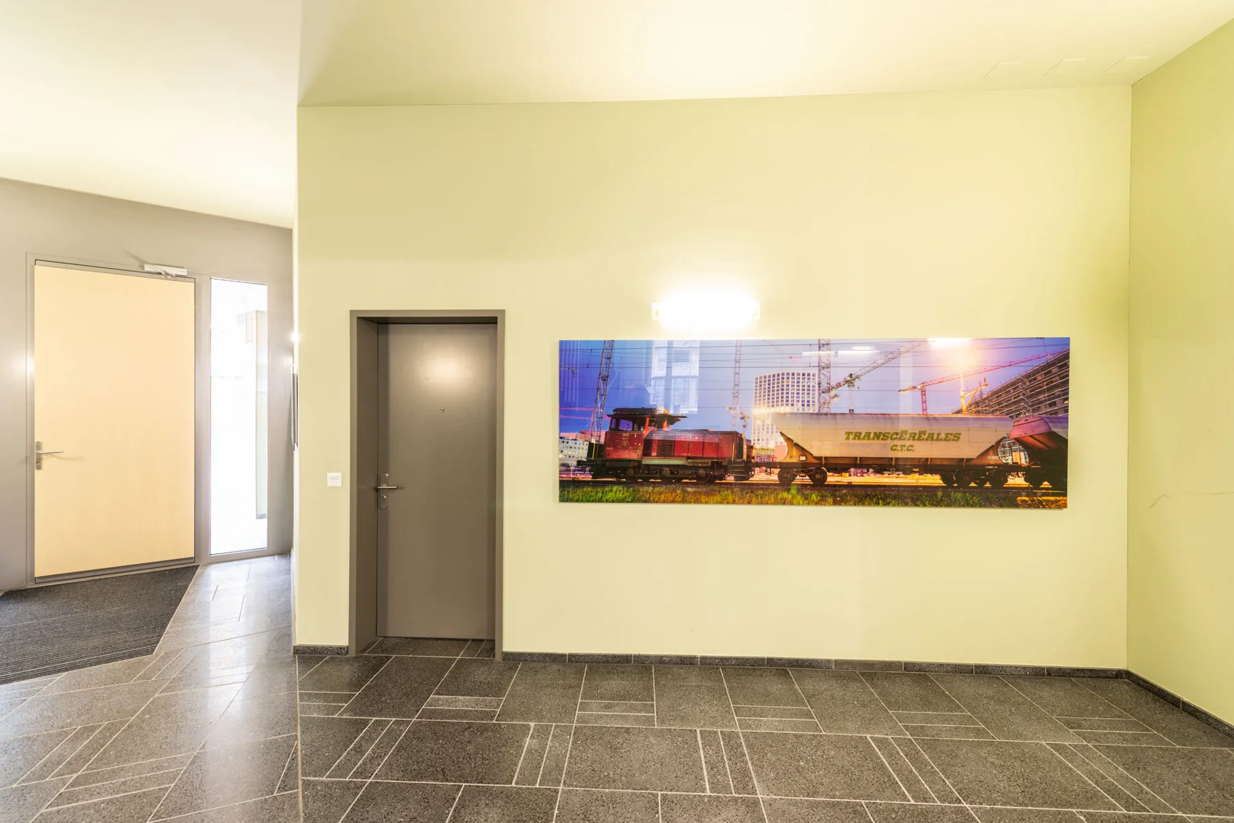 Panoramic photographic artwork of city lights in a stairwell