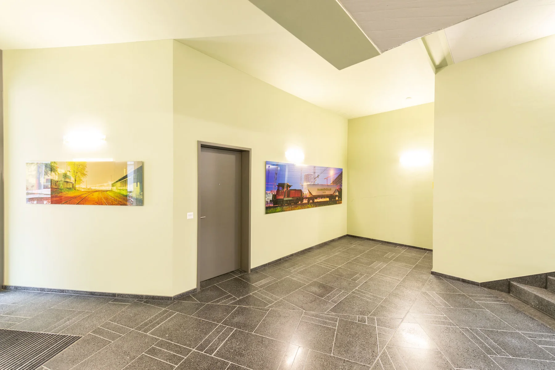 Panoramic photographic artwork of city lights in a stairwell