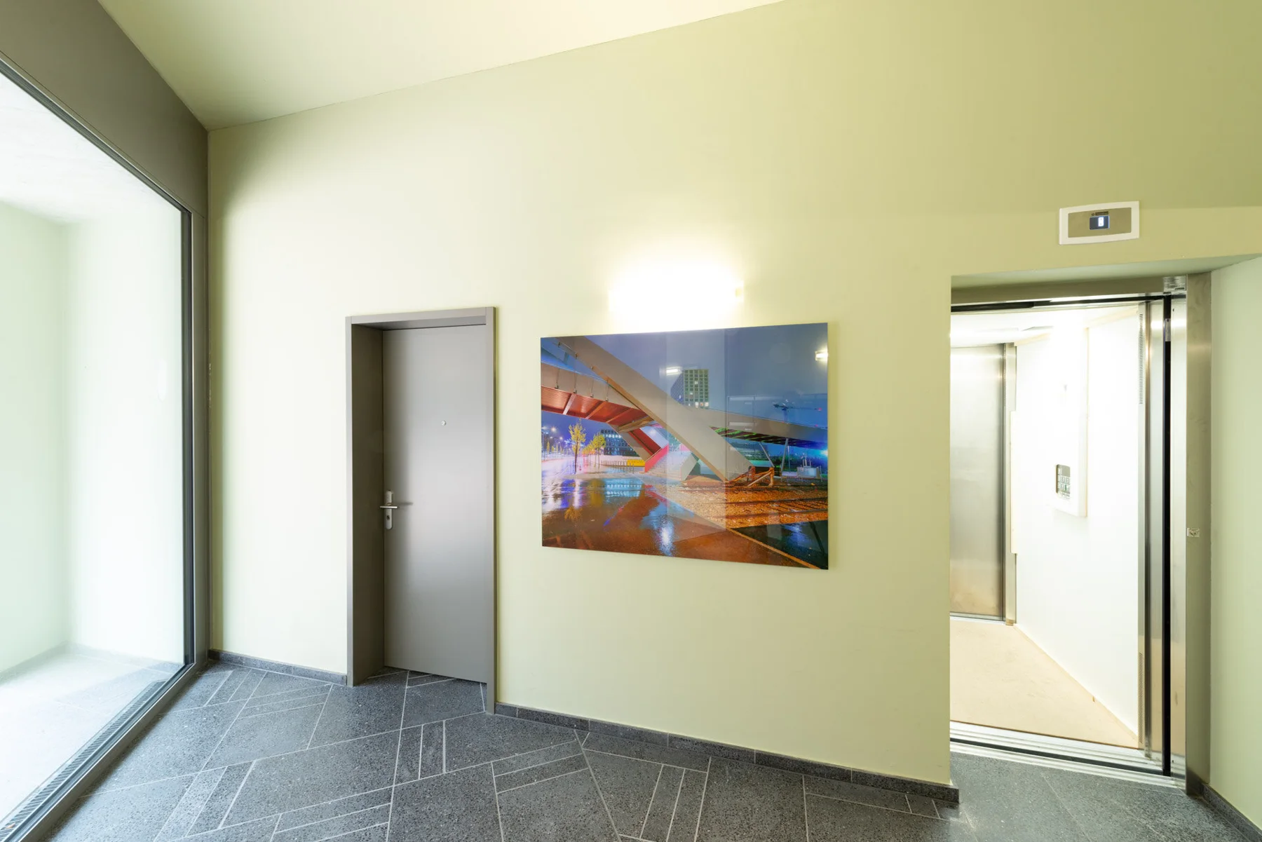 Panoramic photographic artwork of city lights in a stairwell