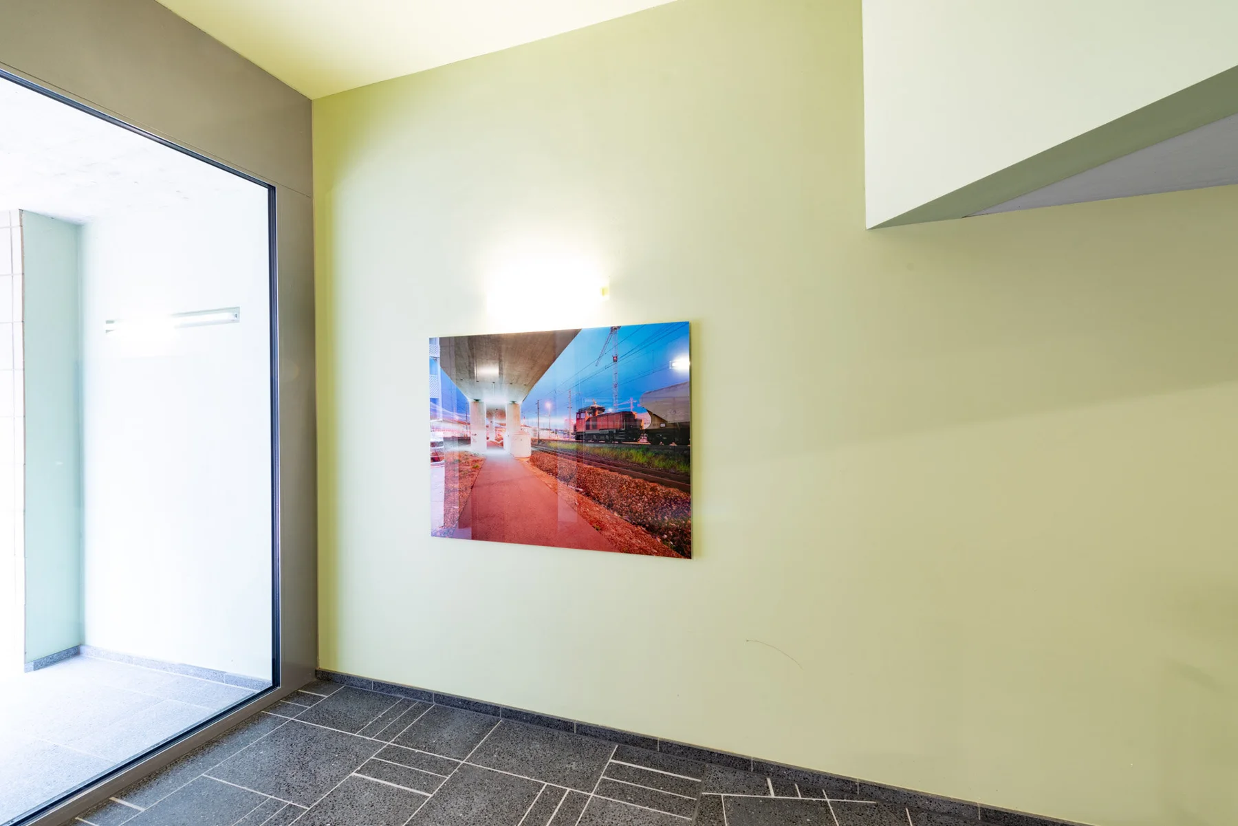 Panoramic photographic artwork of city lights in a stairwell